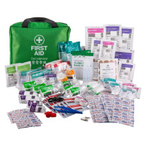 Green Decakit3 Deca Med Large First Aid Kit bag with various medical supplies and dressings displayed around it