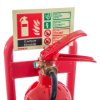 Close-up of red metal extinguisher stand handle with safety instruction label showing carbon dioxide details