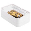an angled shot of the back of a rectangular shaped carbon monoxide alarm showing the double A batteries in the battery compartment