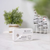 White Ke2030Dcr Kidde 2030Dcr Battery Carbon Monoxide Alarm placed on a white surface with blurred plants in the background