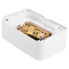 carbon monoxide alarm showing the battery compartment with two AA batteries inside
