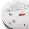 Back closeup view of kidde firex mains powered optical smoke alarm alkaline battery backup showing warning and caution labels
