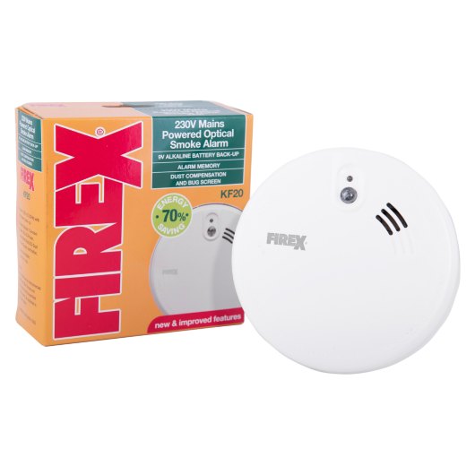 kidde firex mains powered optical smoke alarm alkaline battery backup shown with packaging box behind the alarm unit