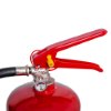 Close-up of the handle on a powerx 4kg powder extinguisher showing the red lever and pressure gauge