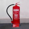 ultrafire 6l water mist fire extinguisher on a grey stand against a white wall and grey floor